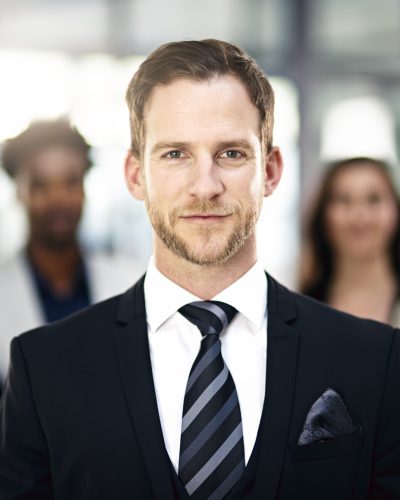 Corporate confidence. Cropped portrait of a group of businesspeople standing in the office